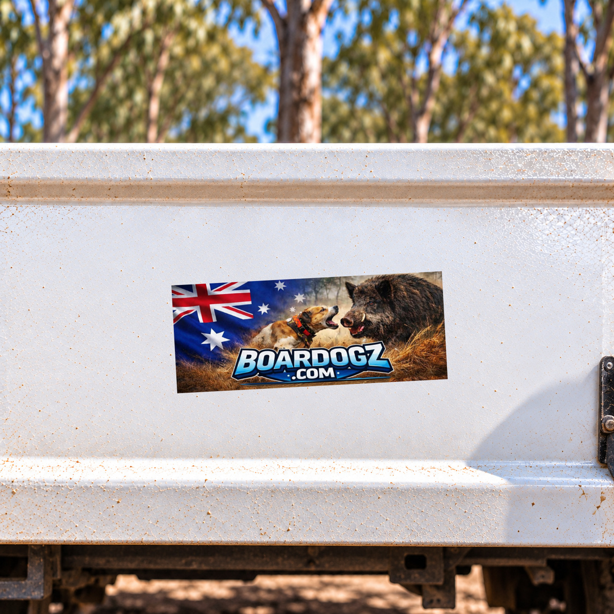 Glossy Boardogz bumper sticker applied at a slight angle to a white ute tray.