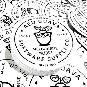 a pile of round white die cut stickers